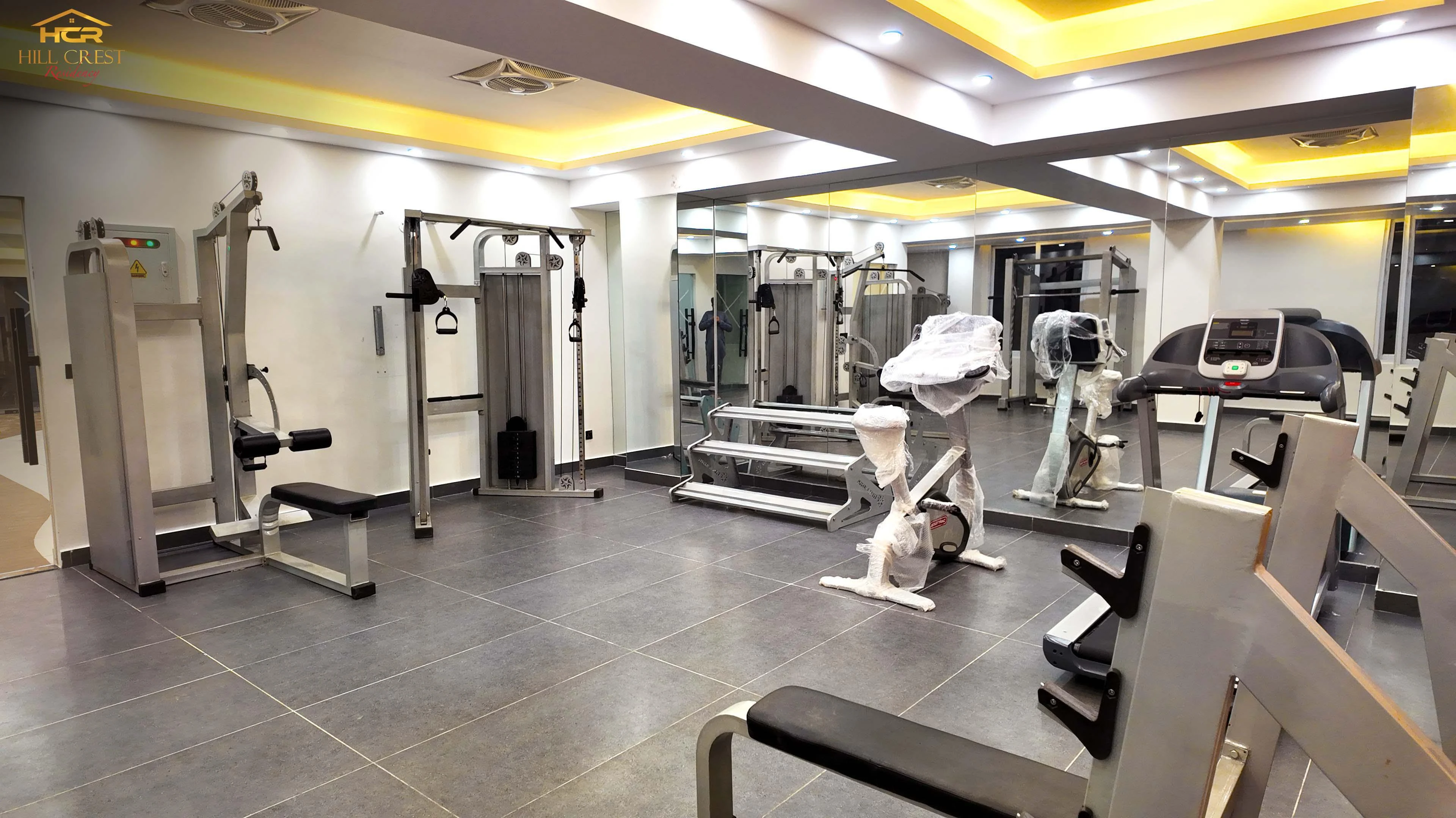 Hill Crest Residency luxury apartment living room with modern furniture and panoramic city views